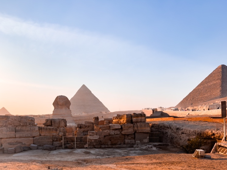 The Sphinx with the pyramids of Khafre and Khufu behind it