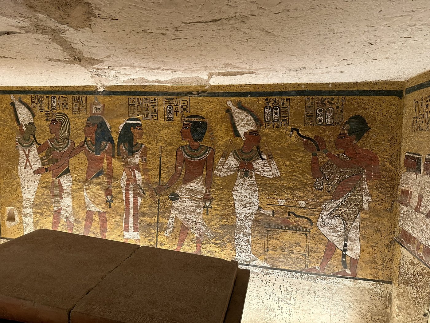 Painted burial chamber of Tutankhamun's tomb with his stone sarcophagus