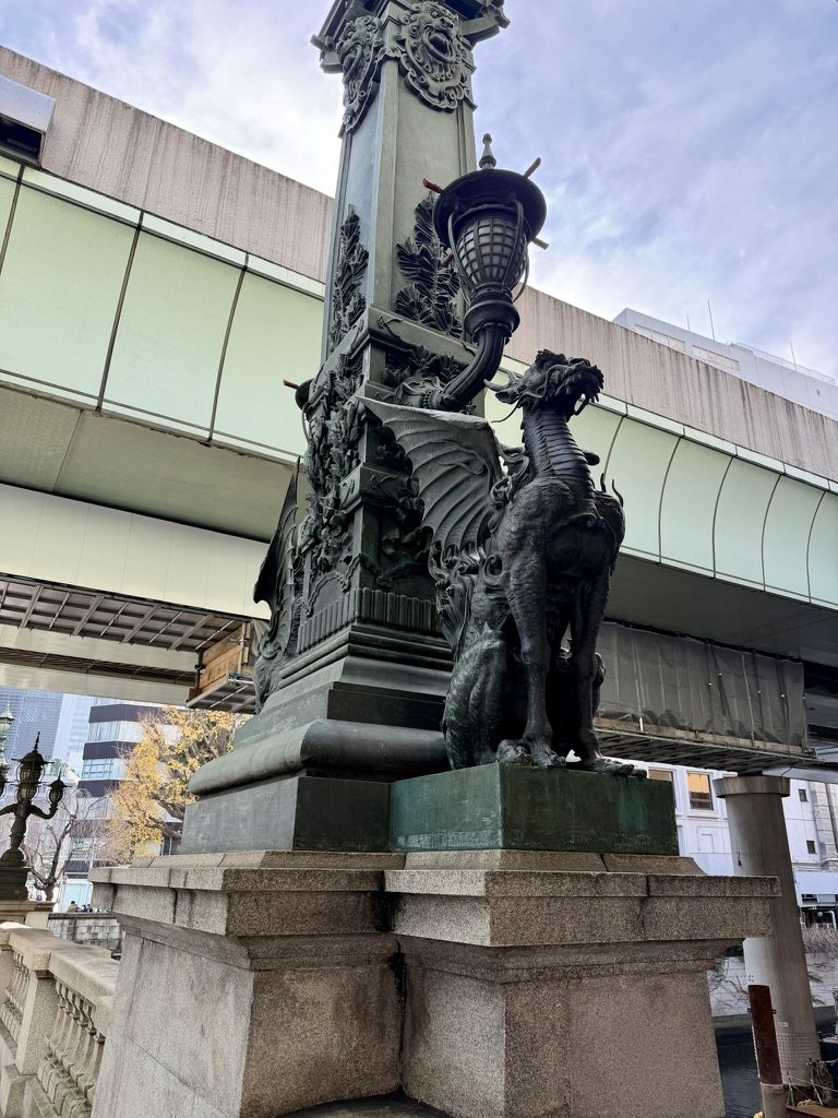 A bronze winged kirin on the Nihonbashi bridge, under the expressway
