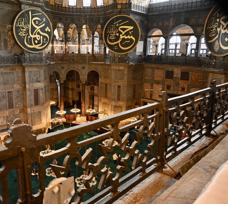 The interior of Hagia Sophia from the upper gallery, with two calligraphic roundels