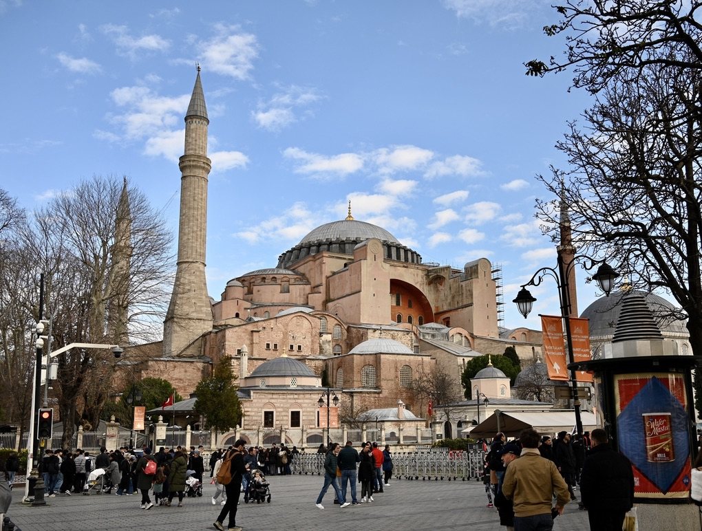 Hagia Sophia from the square, with its dome, buttresses, and a minaret