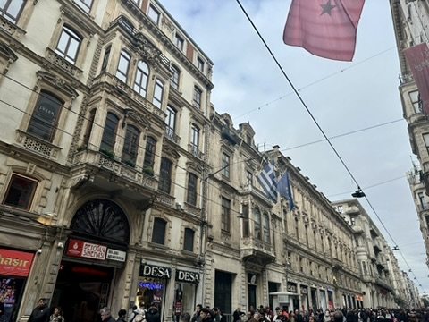 Ornate 19th-century façades on İstiklal Avenue, with Greek and Turkish flags
