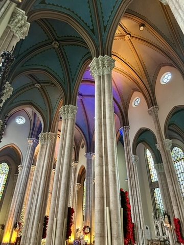 The vaulted, lit interior of St. Anthony of Padua, decorated for Christmas