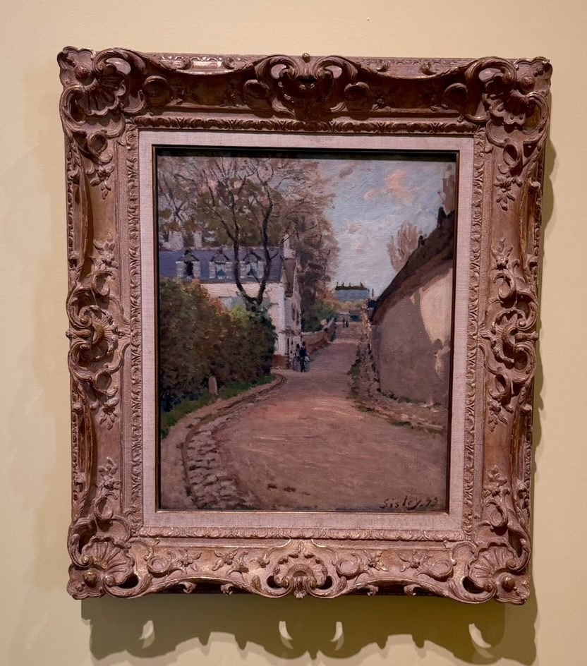 Sisley, a village street curving between houses